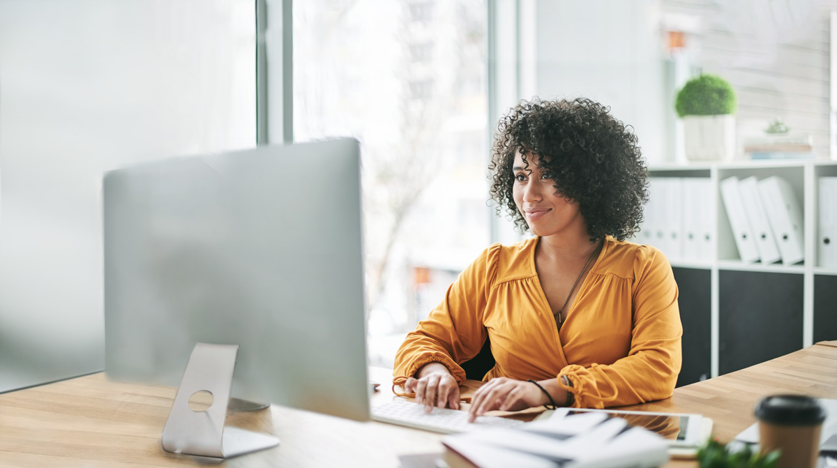 Photo of a woman using a computer.