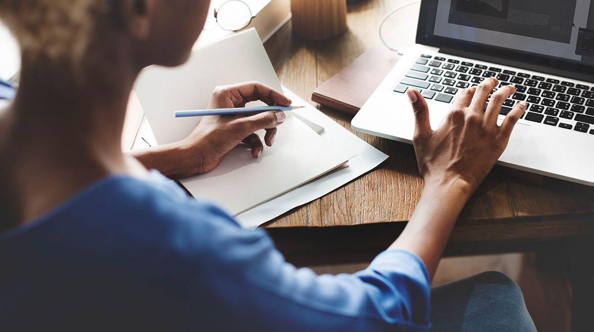 Photo of a woman using a laptop.