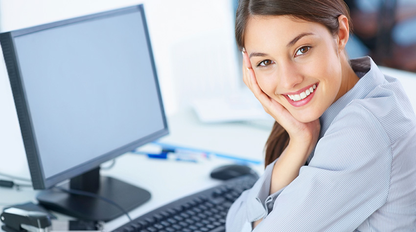 Photo of a woman using a computer.